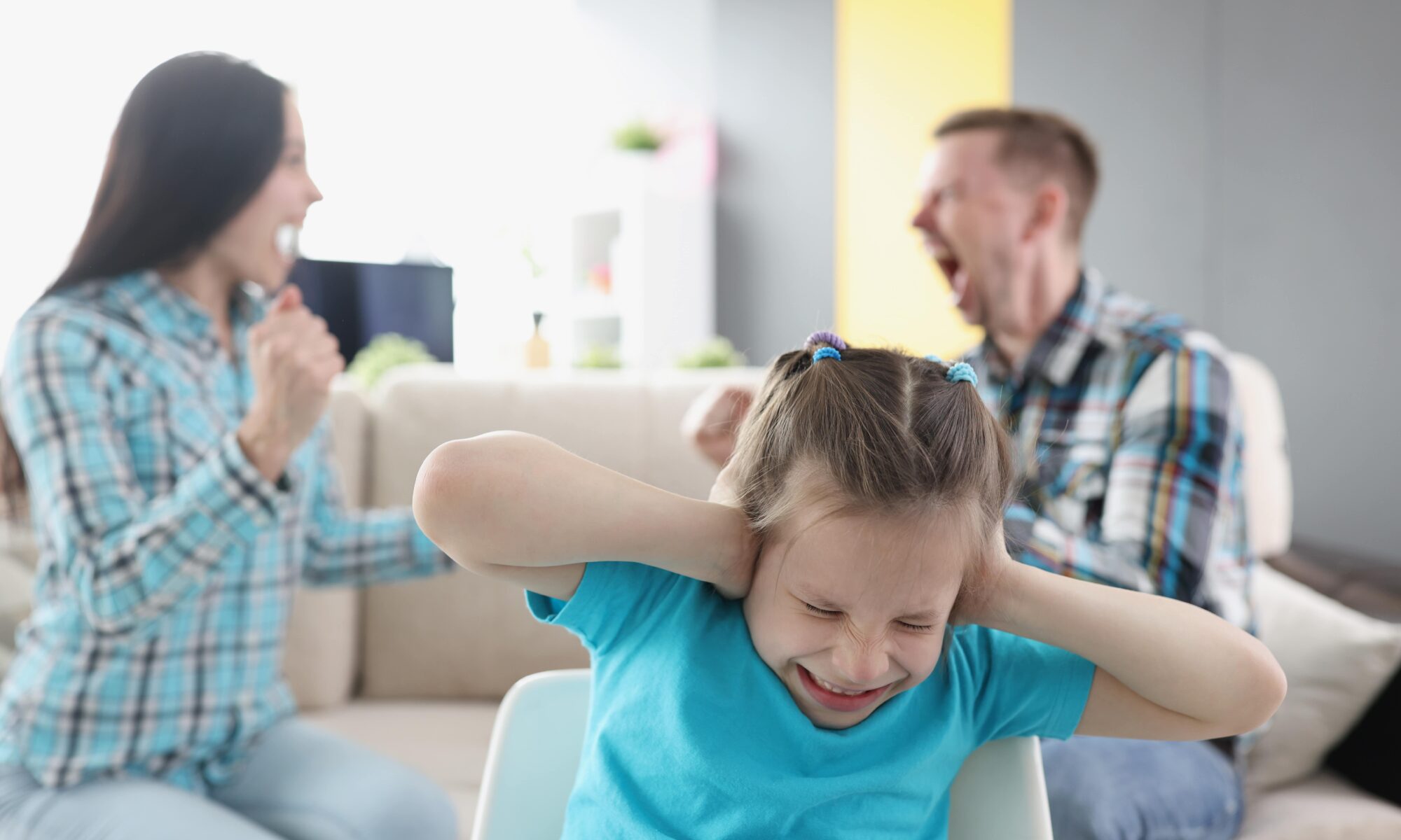 little-girl-closing-her-ears-against-background-swearing-parents-home-min